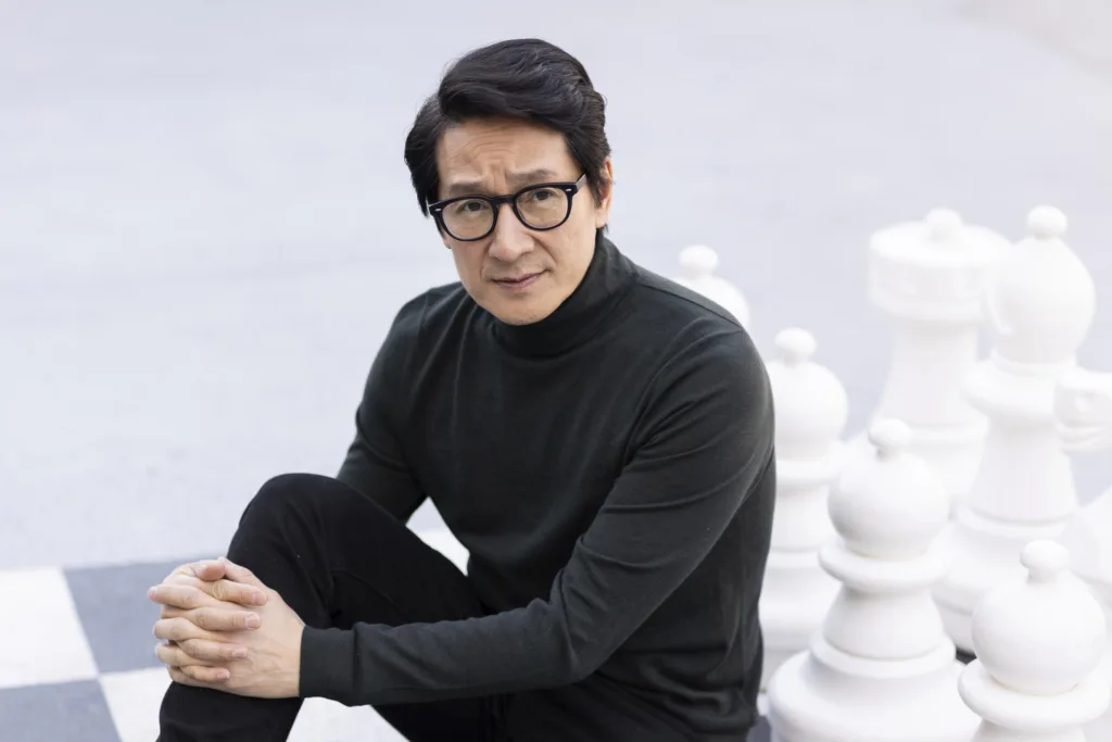 Image of Ke Huy Quan with case board